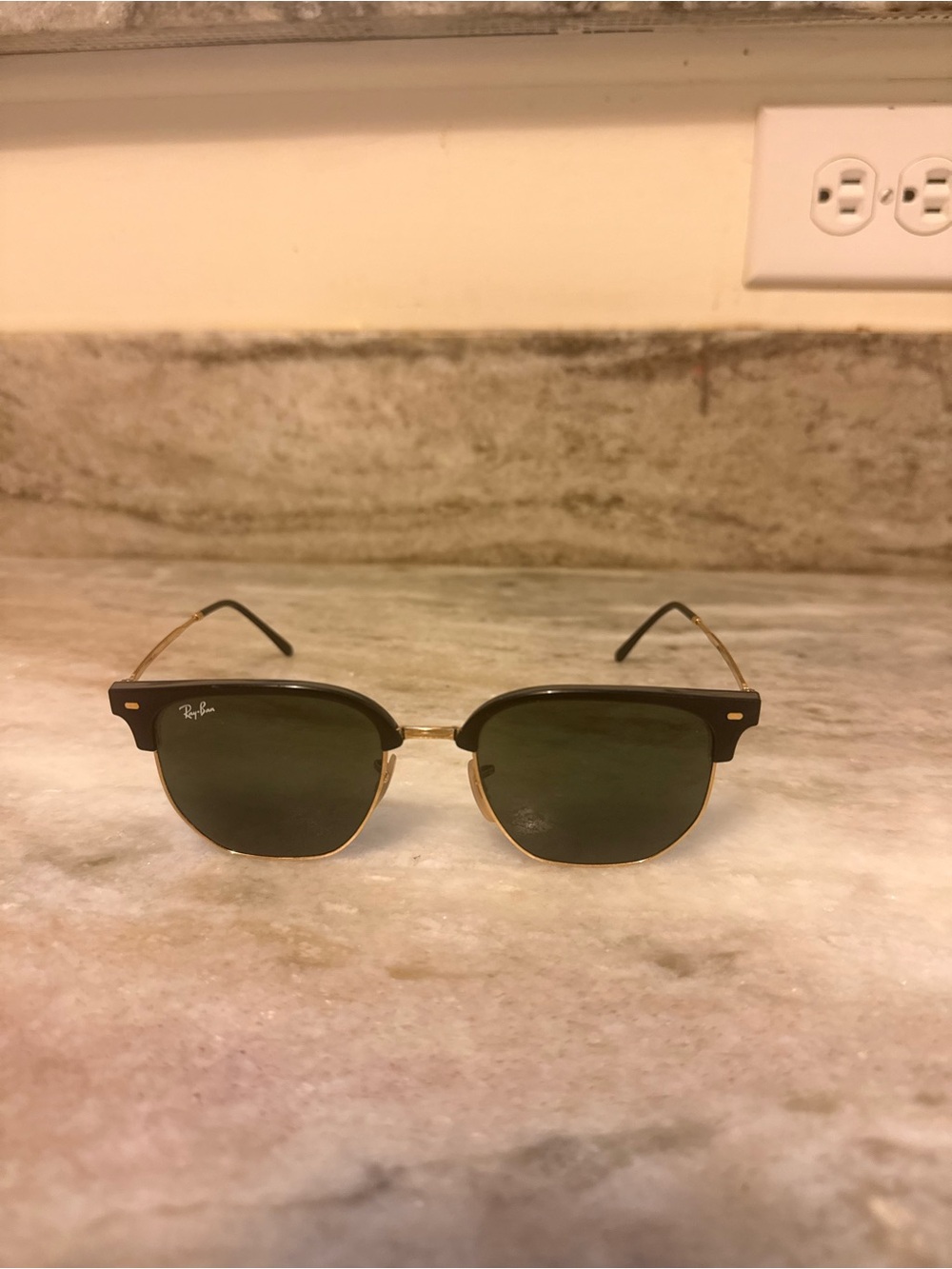 Ray-Ban Men’s Black and Gold Clubmaster Sunglasses.